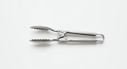 Shiny metal tongs on white background