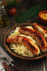 A bowl with Bratwurst and Sauerkraut as side dish - traditional German food	