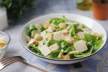A bowl with classic Caesar salad