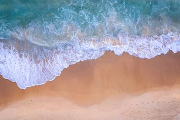 Fotobehang Slaapkamer Amazing Top view sea beach landscape background,Summer sea waves crashing on sandy shore seascape background,High angle view ocean nature background  © Panya