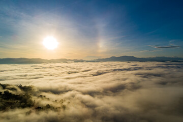 Amazing Sunrise over mountains hills covered with mist, Aerial view landscape drone shot beautiful...