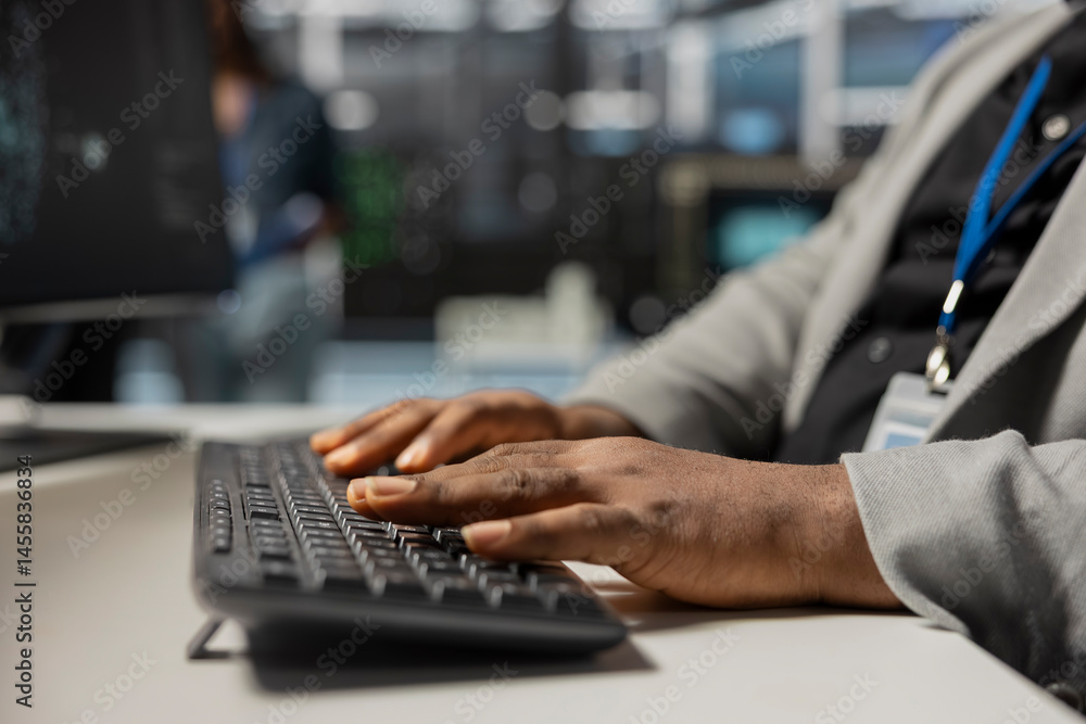 Poster close up of data center technician typing on keyboard, inspecting gear, doing maintenance tasks. ser