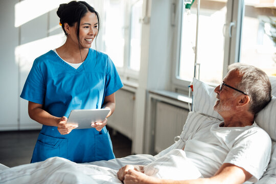 Nurse providing care and support to a patient in a hospital setting