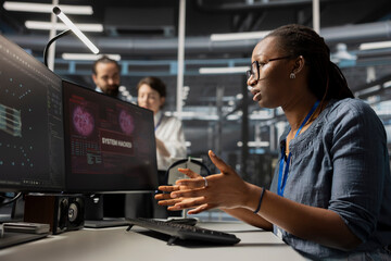 Scared admin in data center panicked by virus alert, initiating protocol to protect critical...
