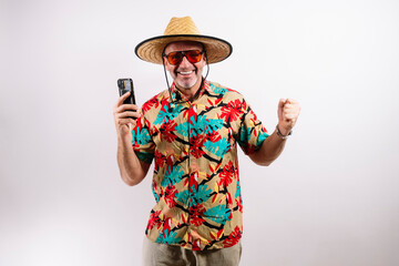 Excited man holding smartphone, celebrating success