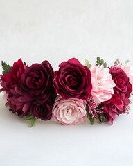 Elegant floral headband made of red and pink roses and other blossoms suitable for celebrations or costume events