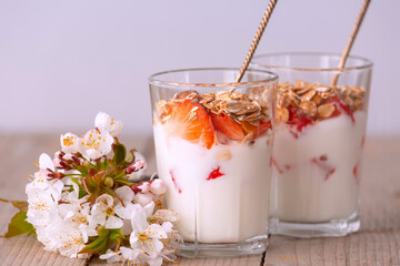 Muesli with yogurt and fresh berries, flowers
