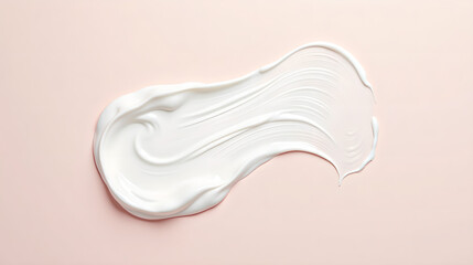 White skincare cream texture smear on soft pink surface
