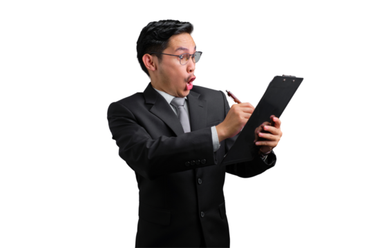 Handsome Asian businessman in suit looking surprised while writing on clipboard, isolated on transparent background