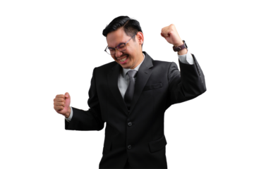 Handsome Asian businessman in suit celebrating success with raised fists, isolated on transparent background