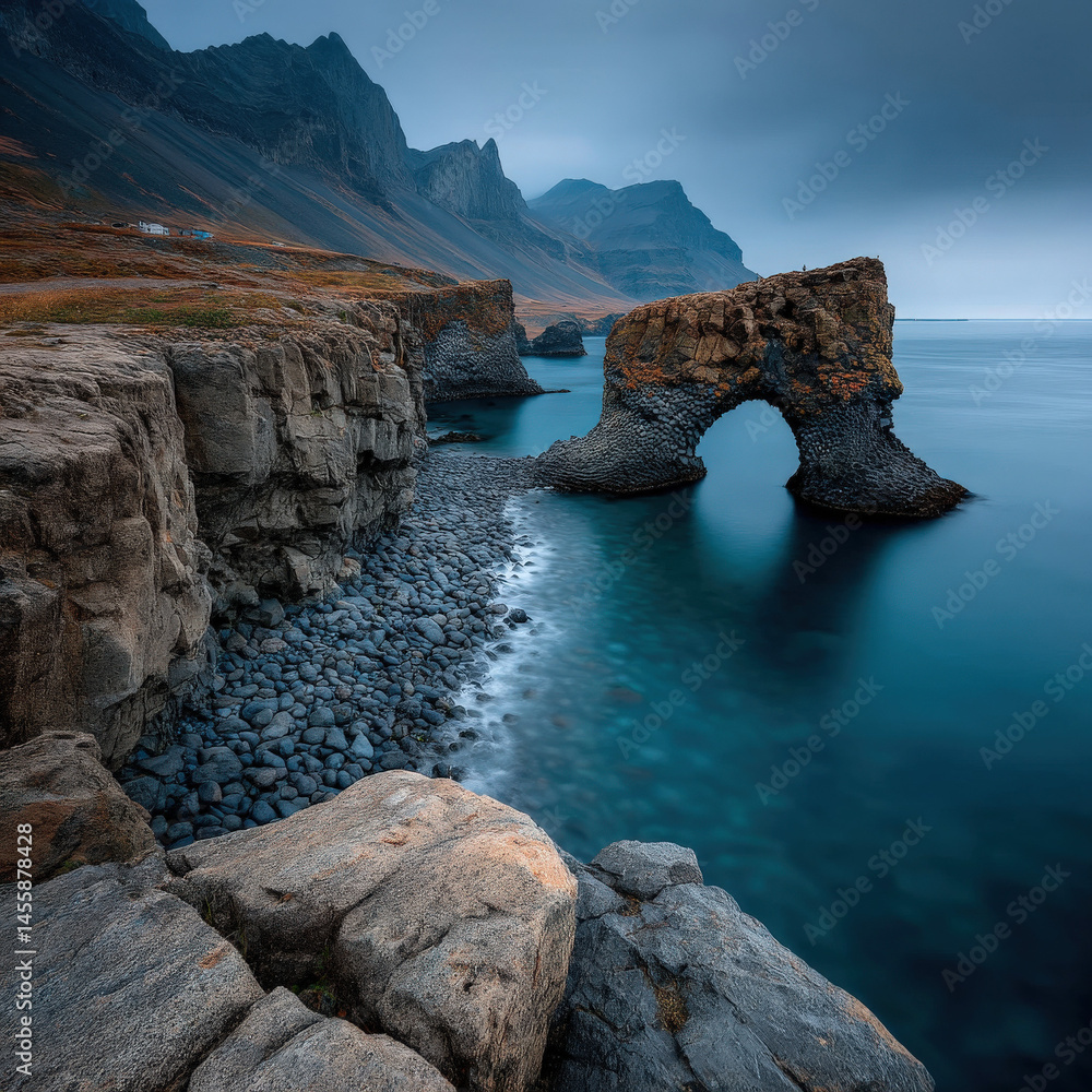 Poster dramatic coastal scene featuring a natural rock arch formation dark basalt cliffs and a pebble beach