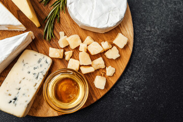 Elegant cheese platter with honey and herbs for a gourmet experience