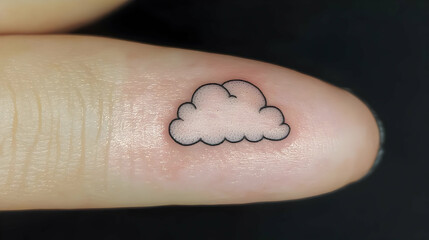 Tiny cloud tattoo on fingertip.  Simple, minimalist design of a stylized cloud inked on a finger