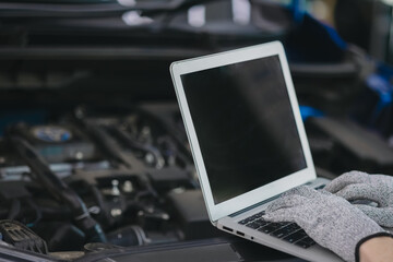 Close-up of a car diagnostic system in use, as a skilled mechanic carefully inspects engine data to provide precise maintenance and reliable repair services in a professional auto repair garage