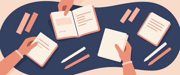 hands collaborating with books and papers on table