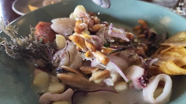 Mixing up a bowl of Peruvian ceviche 