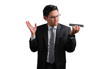 Handsome Asian businessman in suit holding smartphone and gesturing with hand, showing confusion, isolated on transparent background