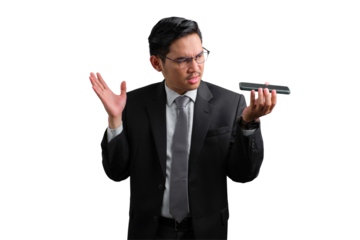 Handsome Asian businessman in suit holding smartphone and gesturing with hand, showing confusion, isolated on transparent background