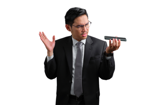 Handsome Asian businessman in suit holding smartphone and gesturing with hand, showing confusion, isolated on transparent background