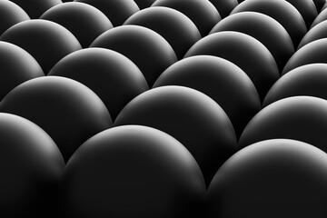 Fototapeta premium Dark spheres forming a uniform pattern creating a mesmerizing texture