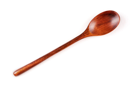 Brown wooden spoon (tablespoon) on a white insulated background.