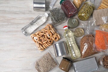 Different food products on wooden table, flat lay