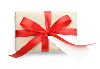 Gift wrapped in kraft paper with bow and card isolated on white, top view