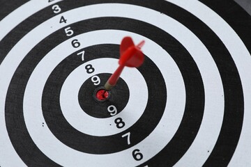 Targeting. Dart board with arrow, closeup view