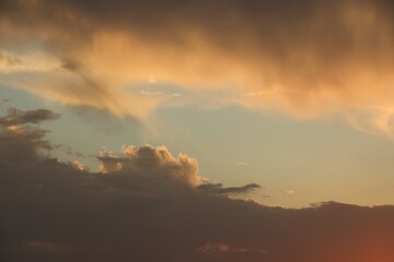 Beautiful sky with fluffy clouds at sunset