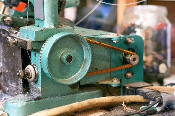 Old overlock for repairing and sewing clothes in a tailor's workshop