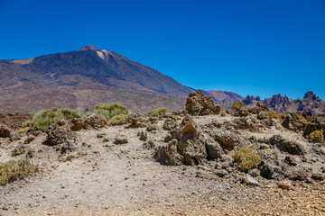 Majestic view of Mount Teide, a striking volcanic peak in Tenerife, surrounded by rugged terrain