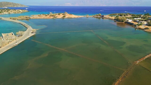 Low drone view of sunken archaeological site of Olous, Elounda, Crete, Greece.