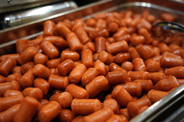 Cooked Cocktail Sausages Piled at Buffet