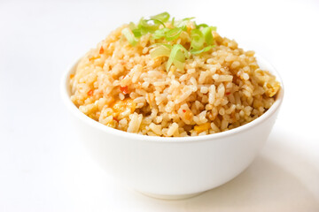 a bowl of fried rice isolated on a white background