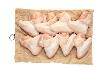 Raw chicken wings on cutting board isolated on white background.