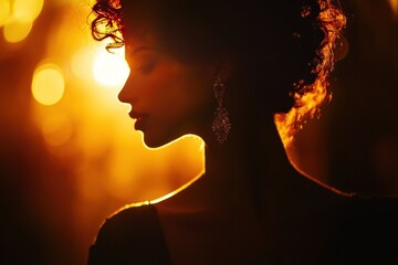 golden hour photo, womanâ€™s silhouette against dramatic warm glow
