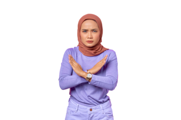 Serious young Asian woman crossed hand and showing refusal gesture isolated on transparent background