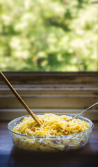 Close-up of Creamy Spaghetti Carbonara with Bacon and Herbs - vertical