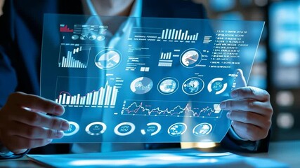 Businessman Holding Interactive Holographic Dashboard, Animated Graphs and Spinning Data Circles with Sliding Camera View - Powered by Adobe