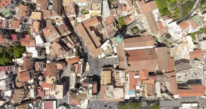 Aerial perpendicular view of the historic center of Amalfi, in the province of Salerno, in Campania, Italy. Among the alleys there are the Cathedral and the main square of the town.
