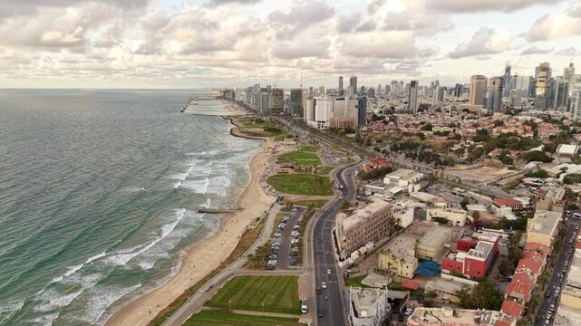 Aerial video of Tel Aviv Jaffa coastline in Israel during daylight 