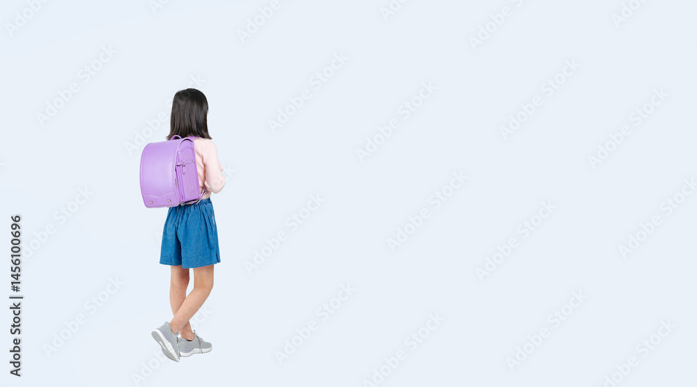 Aufkleber ランドセルを背負って歩く小学生の女の子の後ろ姿の全身写真（切り抜き背景透過pngも販売しております。↓作成者リンクから「png」で検索してください）
