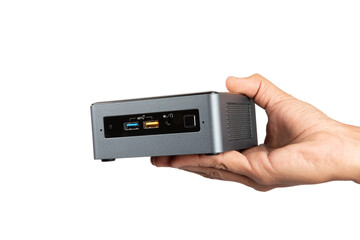Male hand holding a mini pc isolated no background cutout