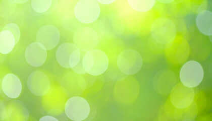 Fototapeta premium Bright green blurred background with soft sparkles and dreamy glow, evoking sense of tranquility and connection to nature. This captures essence of serene environment