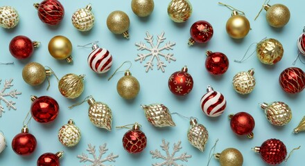 Arrangement of Christmas Ornaments with Snowflakes on Blue