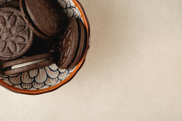 Delicious chocolate cookies in a colorful bowl ready for enjoyment
