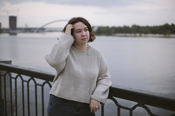 Woman near river, burnout, depression and mental health concept.