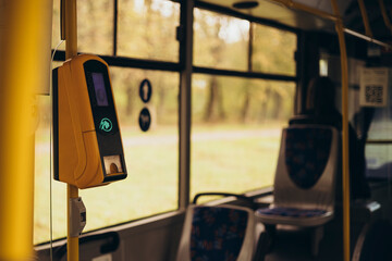 Payment terminal in the bus, non-cash payment for travel in public transport.