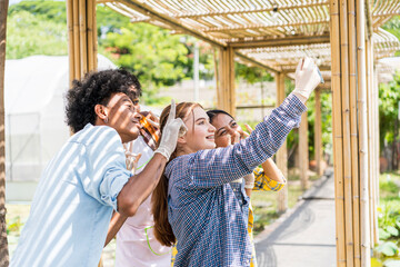 Teenagers on an agricultural tour are taking pictures of themselves.