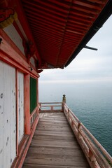 Japanese temple balcony with sea view.